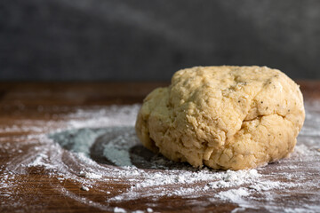 Bakery - yeast dough for bread, pizza or scone on a floured surface, with flour splash. Cooking bread. Kneading the Dough. Long banner format