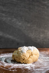 Bakery - yeast dough for bread, pizza or scone on a floured surface, with flour splash. Cooking...