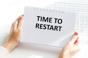 businesswoman holding paper plate with text TIME TO RESTART.