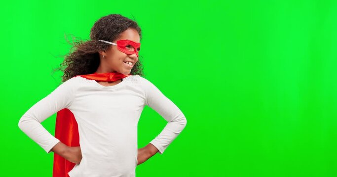 Superhero, happy and child in a studio with green screen with mockup space for advertising. Costume, fantasy and girl kid with wind blowing her cosplay outfit to stop crime by a chroma key background