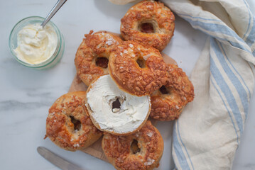 home made whople grain Bagels with cheese on a table