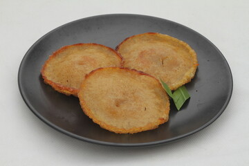 Kue cucur is a traditional Indonesian snack made from rice flour and brown sugar and then fried.soft focus and shiny texture