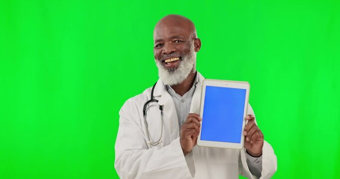 Doctor face, tablet and green screen isolated on studio background telehealth, medical or happy service marketing. Healthcare professional or senior black man show digital technology and mockup space