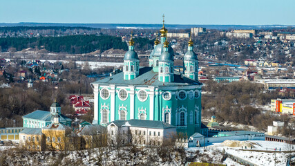 panoramic view from a drone of the historical part of Smolensk with a fortress wall and churches on a sunny winter day