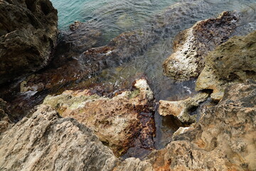 sea waves crashing against the rocks	