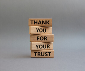 Thank you for your trust symbol. Wooden blocks with words Thank you for your trust. Beautiful grey background. Business and Thank you for your trust concept. Copy space