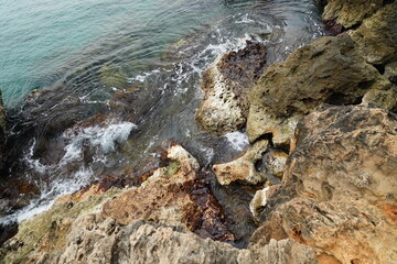 sea waves crashing against the rocks	