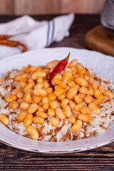 Dry bean pilaf. Traditional Turkish cuisine. Turkish dry beans and rice with ayran and hot pepper. local name kuru fasülye pilav. Close up