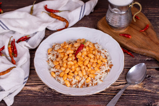Dry bean pilaf. Traditional Turkish cuisine. Turkish dry beans and rice with ayran and hot pepper. local name kuru fas&uuml;lye pilav