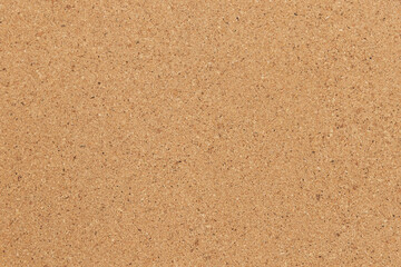 Cork background in beige color. Brown cork texture.