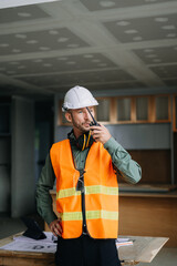 Handsome man team architect on a building industry construction site.