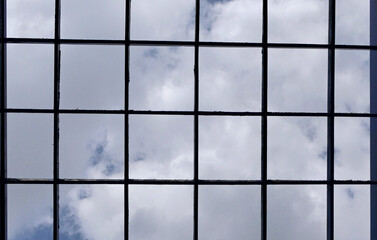square frame of a window on a sky background
