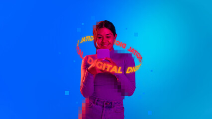 Fototapeta na wymiar Young smiling girl chatting on smartphone with neon lettering Digital around head isolated over blue background