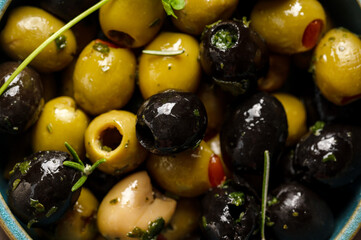 Black and green olives macro. Delicious, marinated olives. Top view.