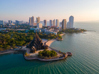 Sanctuary of Truth, Pattaya, Thailand, wooden temple by the ocean at sunset on the beach of Pattaya