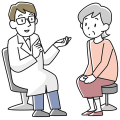 医師の診察を受けるシニア女性