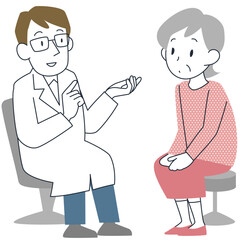 医師の診察を受けるシニア女性