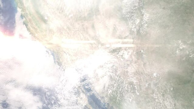 Earth zoom in from outer space to city. Zooming on Queen Creek, Arizona, USA. The animation continues by zoom out through clouds and atmosphere into space. Images from NASA