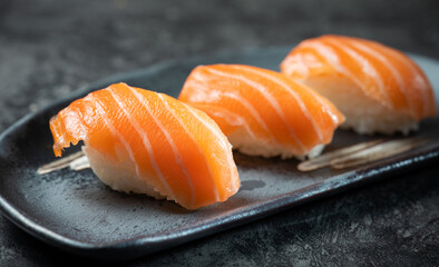 Raw salmon sushi on a plate	