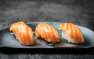 Raw salmon sushi on a plate