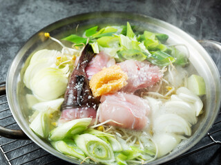 Monkfish Soup , A dish made with monkfish as the main ingredient and boiled with bean sprouts	