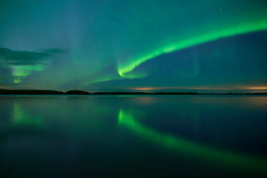 Northern light dancing over the sky in Farnebofjarden national park in north of Sweden.