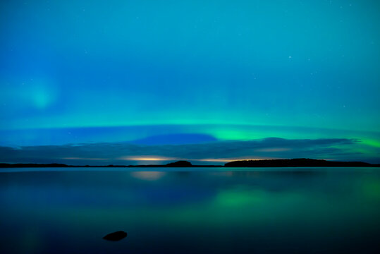 Northern light dancing over the sky in Farnebofjarden national park in north of Sweden.