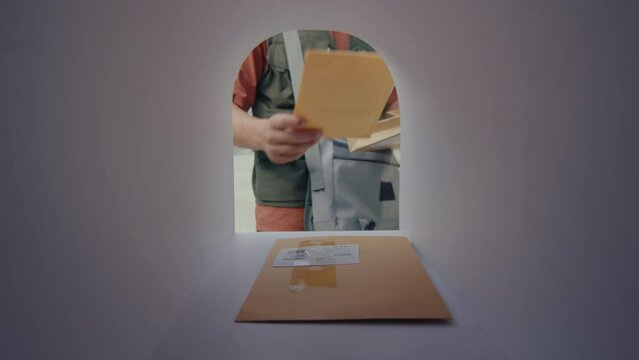 Postman opening mailbox, putting letters inside, and then closing while bringing the mail. POV shot from inside of the mailbox