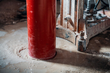 Drilling a hole into a concrete floor with core driller