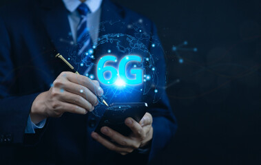 businessman holding a smartphone with hologram 6G digital technology. 6G wireless internet network concept or IOT, high speed communication connection.	
