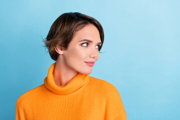 Photo of lovely nice girl look empty space blank proposition isolated on blue color background