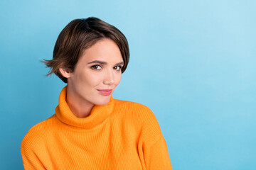 Photo portrait of attractive young woman look camera shopping cosmetics dressed stylish orange clothes isolated on blue color background