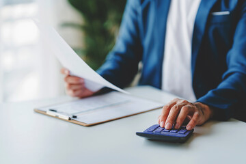 Close-up of business people working on taxes, financial accounting calculations, brokerage, copy space