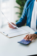 Close-up of business people working on taxes, financial accounting calculations, brokerage, copy space