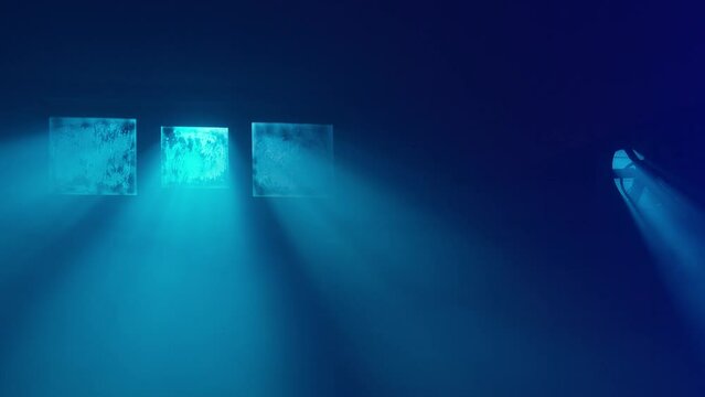 Interior night shot of an empty basement. Blue light, dirty window and fan. 