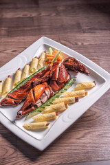 Beijing roasted whole big pipa bbq duck with crepe skin roll and vegetables on wood table background asian Chinese halal banquet meat menu 