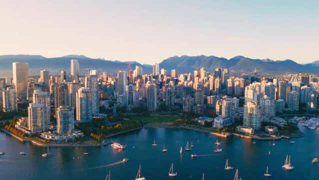 Vancouver downtown skyline aerial crane up shot, BC, Canada at sunset