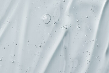 Texture of face serum. Abstract background of moisturising transparent gel.