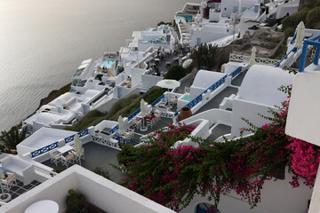 Whitewashed houses with terraces and pools and a beautiful view in Imerovigli on Santorini island,...