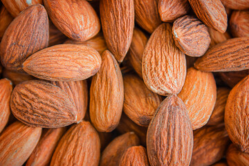 Almond background. Close-up of raw almonds, full frame.