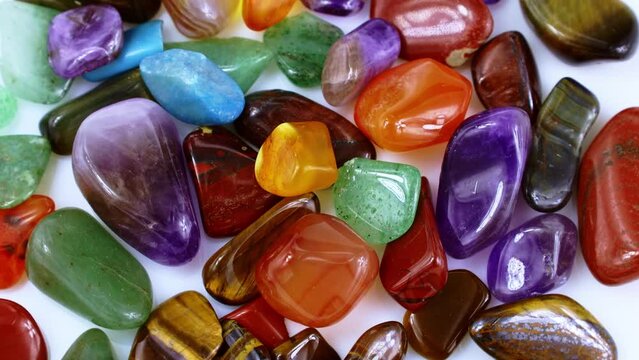 Top view of different colorful semiprecious mineral gemstones circle rotation close up