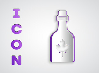 Paper cut Bottle of maple syrup icon isolated on grey background. Paper art style. Vector