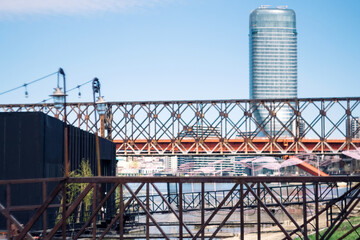 Obraz premium Metal bridge over the river Sava and urban skyline of Belgrade waterfront in Belgrade Serbia