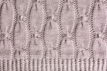 Background with knitting pattern for sweater with cables. Above overhead shot