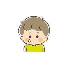 悲しい表情で片目からポロリと涙をこぼす男児の上半身