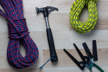two climbing ropes and some pitons with a hammer