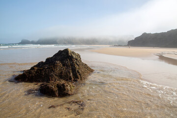 Sea, Cliffs and Rocks With Fog at Odeceixe Beach; Algarve; Portugal