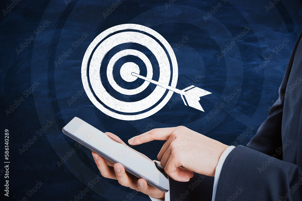 Aufkleber close up of businessman holding pointing at cellphone with drawn target and arrow on blue background