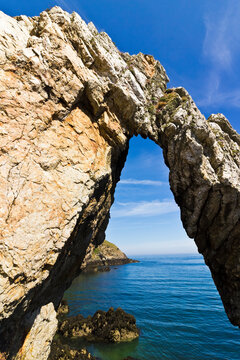 Coastal arch formation on the bay at Porthwen adjacent to now unused Porth Wen brickworks site, Area of Oustanding Natural Beauty, Anglesey, Gwynedd, North Wales