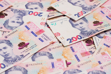 Money background, many bills close-up. Many Ukrainian hryvnias close-up